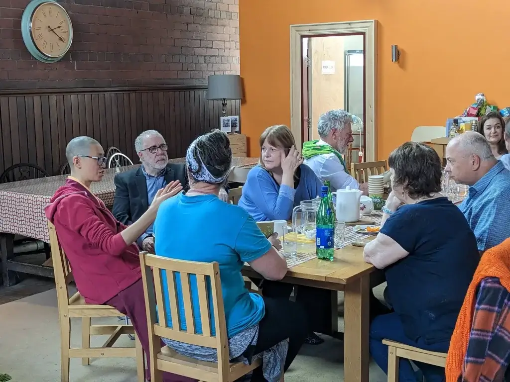 People relaxing after a meditation class at Vajrapani Kadampa Meditation Centre